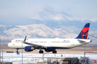 FILE - A Delta Airlines jetliner taxis on a runway at Denver International Airport after a winter storm swept through the region on Jan. 16, 2024, in Denver. Delta reports earnings on Thursday, July 11, 2024. (AP Photo/David Zalubowski)