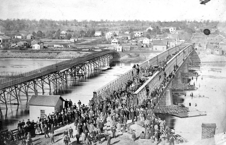 This photo provided by Lee County Historical and Genealogical Society shows the Truesdell Bridge in Dixon, Ill., in 1873. It's been 150 years since the bridge collapsed, remaining the worst road-bridge disaster in American history. On May 4, 1873, a crowd of more than 200 gathered on the bridge to watch a baptism when it toppled over, trapping dozens of victims just inches below the river's surface. The disaster claimed 46 lives and injured dozens of others. (Charles Keyes/Lee County Historical and Genealogical Society via AP)