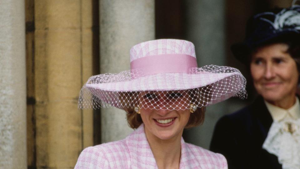 Diana in a netted hat with pink checked coat 