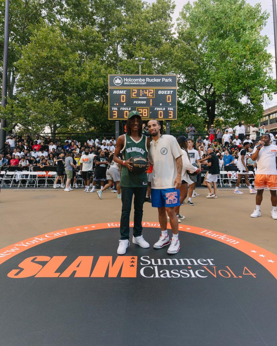 Dooney Johnson, left, poses with New Orleans Pelicans point guard Jose Alvarado after receiving the People's Champ Award at the 2nd annual NBPA Players' Voice Awards NextGen at historic Rucker Park in New York on Aug. 16, 2022.