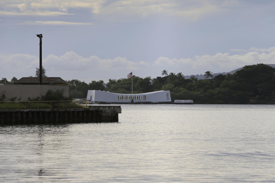 The USS Arizona Memorial can be seen from the Pearl Harbor National Memorial Wednesday, Dec. 4, 2019, in Honolulu. A U.S. sailor shot and wounded several civilian Department of Defense employees at the Pearl Harbor shipyard Wednesday before taking their own life, the military said. The shipyard is across the harbor from the Pearl Harbor National Memorial. (AP Photo/Marco Garcia)