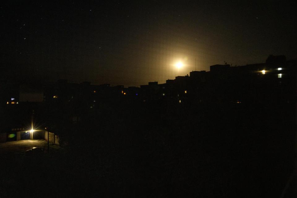 FILE Residents switch their lights off during curfew hours, in Pokrovsk, Donetsk region, eastern Ukraine, Thursday, July 7, 2022. Ukrainians living in the path of Russia's invasion in the besieged eastern Donetsk region are bracing themselves for the possibility that they will have to evacuate. The mayor of Pokrovsk is mentally preparing for a military-ordered evacuation in which he would be among the last to leave. (AP Photo/Nariman El-Mofty, File)