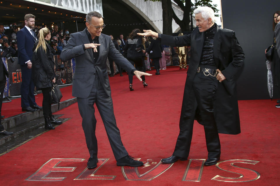 Tom Hanks, left, and Baz Luhrmann pose for photographers upon arrival for the premiere of the film 'Elvis' in London Tuesday, May 31, 2022. (Photo by Joel C Ryan/Invision/AP)