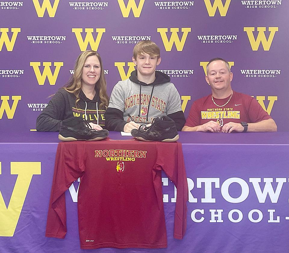 Watertown High School senior wrestler Sloan Johannsen signed to wrestle at Northern State University in Aberdeen on Wednesday, Nov. 15, 2023. He is pictured with his parents Amanda and Darin. Entering his senior season, Johannsen has a chance to become only the second Arrow wrestler to win four individual state championships.