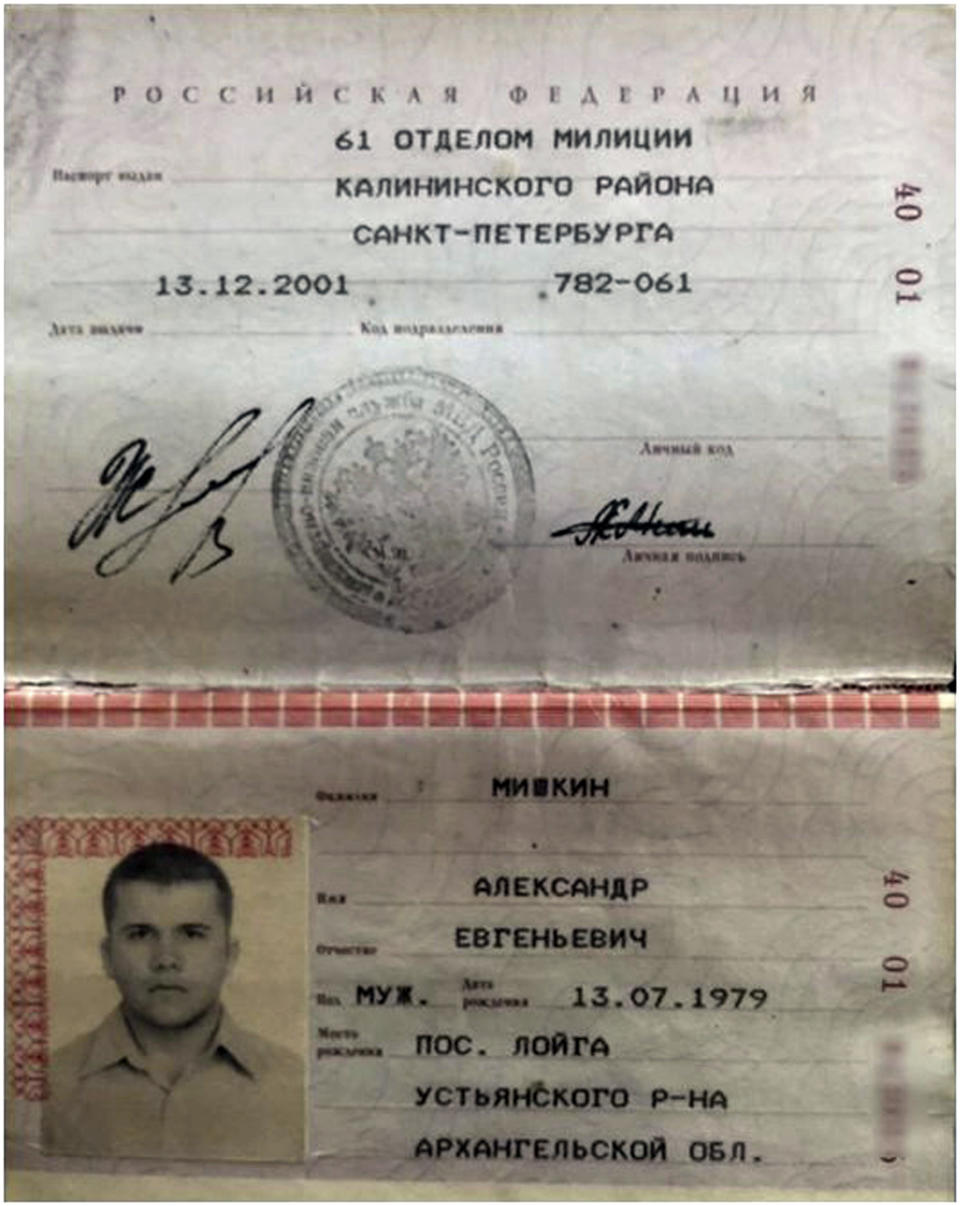 This undated handout image issued by Bellingcat shows the passport Dr Alexander Yevgenyevich Mishkin, the man the investigative website have alleged was who travelled to Salisbury under the alias Alexander Petrov. The investigative group Bellingcat is reporting that one of the two suspects in the poisoning of an ex-spy in England is a doctor who works for Russian military intelligence. Bellingcat said on its website Monday, Oct. 8, 2018 that the man British authorities identified as Alexander Petrov is actually Alexander Mishkin, a trained doctor working for the Russian military intelligence unit known as GRU. (Bellingcat via AP)