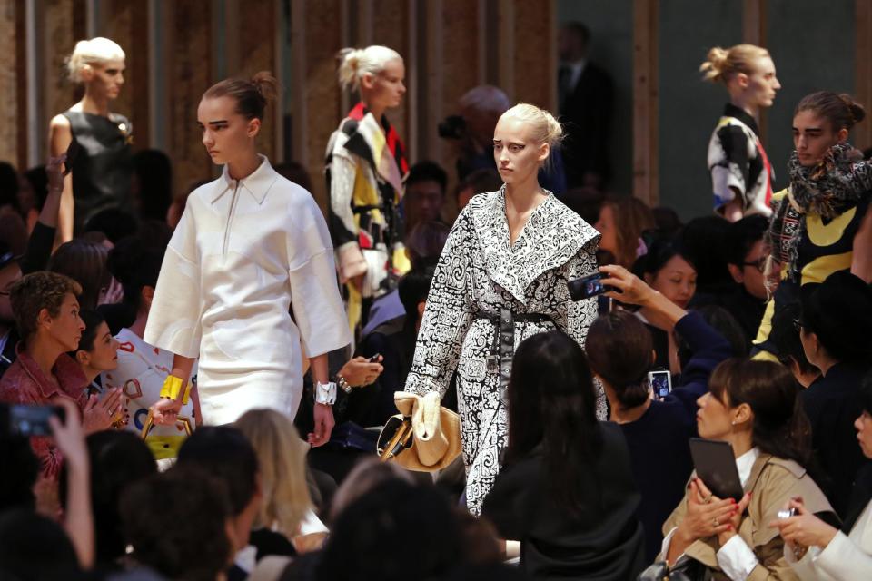 Models present creations as part of Celine's ready-to-wear Spring/Summer 2014 fashion collection, presented Sunday, Sept. 29, 2013 in Paris. (AP Photo/Jacques Brinon)