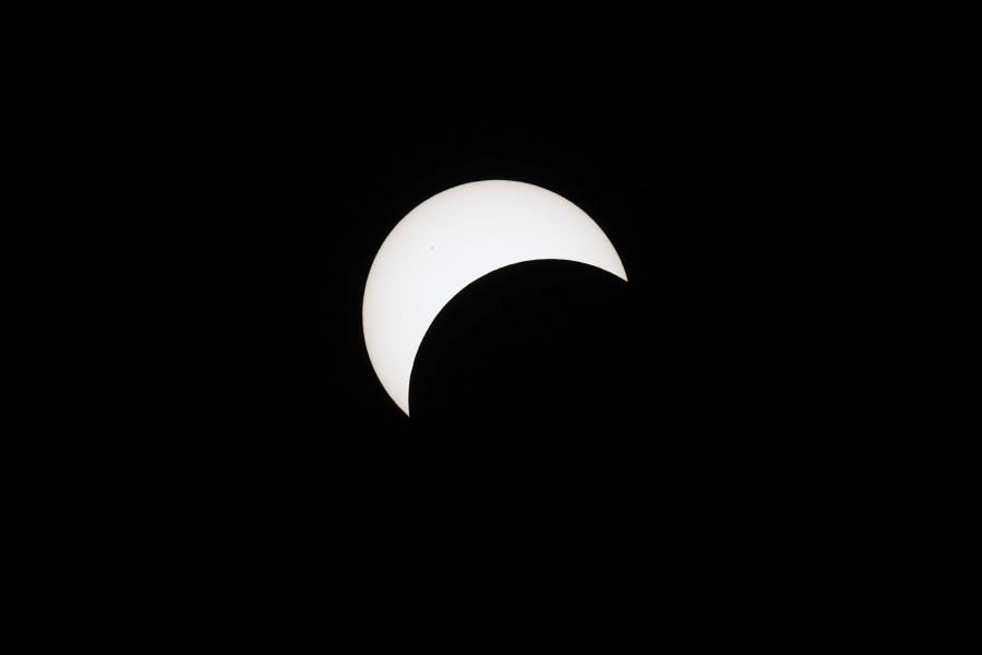 HOULTON, MAINE – APRIL 08: The moon crosses the sun during the eclipse on April 08, 2024 in Houlton, Maine. Millions of people have flocked to areas across North America that are in the “path of totality” in order to experience a total solar eclipse. During the event, the moon will pass in between the sun and the Earth, appearing to block the sun. (Photo by Joe Raedle/Getty Images)