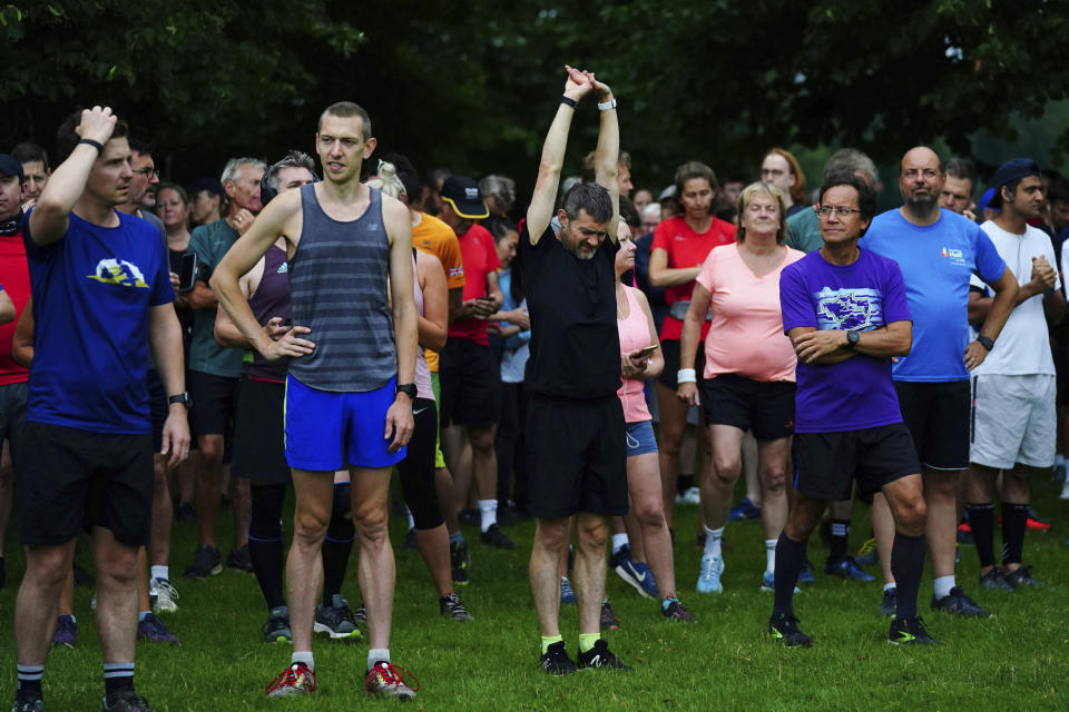 People at the start line of the Park Run at Bushy Park in London, Saturday July 24, 2021, one of many runs taking place across the country for the first time since March 2020 when the event was closed due to the COVID-19 pandemic. (Victoria Jones/PA via AP)