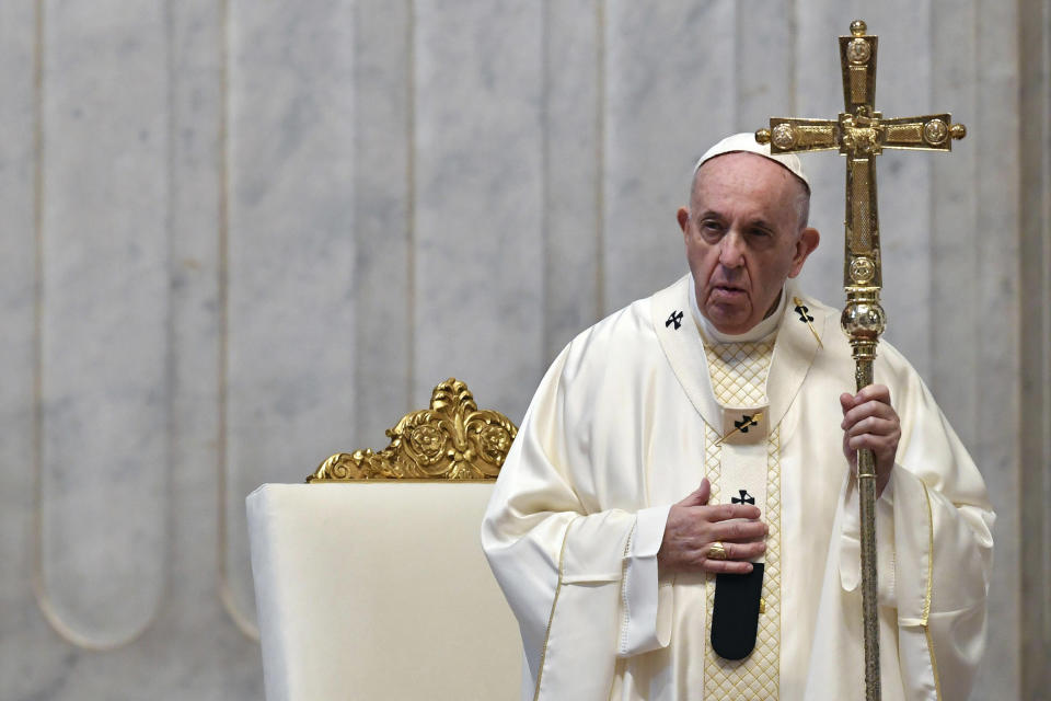 Pope Francis attends a Mass for Holy Thursday, inside St. Peter's Basilica at the Vatican, Thursday, April 9, 2020. Francis celebrated the Holy Week Mass in St. Peter's Basilica, which was largely empty of faithful because of restrictions aimed at containing the spread of COVID-19. The new coronavirus causes mild or moderate symptoms for most people, but for some, especially older adults and people with existing health problems, it can cause more severe illness or death. (Alessandro Di Meo/Pool Photo via AP)