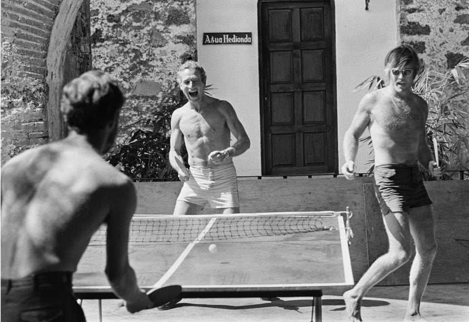 Paul Newman and Robert Redford playing ping pong on the set of “Butch Cassidy and the Sundance Kid.” - Credit: Lawrence Schiller/Courtesy Lawrence Schiller