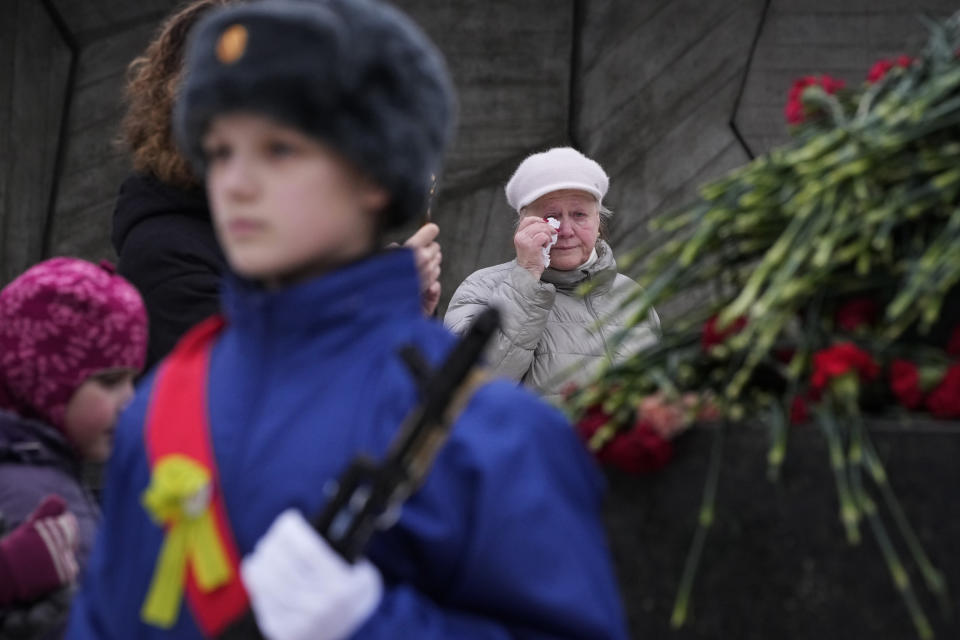 A woman cries during a commemoration ceremony at the monument of the Heroic Defenders of Leningrad, in St. Petersburg, Russia, Saturday, Jan. 27, 2024. The ceremony marked the 80th anniversary of the battle that lifted the Siege of Leningrad. The Nazi siege of Leningrad, now named St. Petersburg, was fully lifted by the Red Army on Jan. 27, 1944. More than 1 million people died mainly from starvation during the nearly900-day siege. (AP Photo/Dmitri Lovetsky)