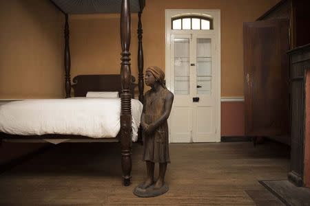 A terra-cotta statue of a child slave inside the main house at the Whitney Plantation in Wallace, Louisiana on January 13, 2015. REUTERS/Edmund Fountain