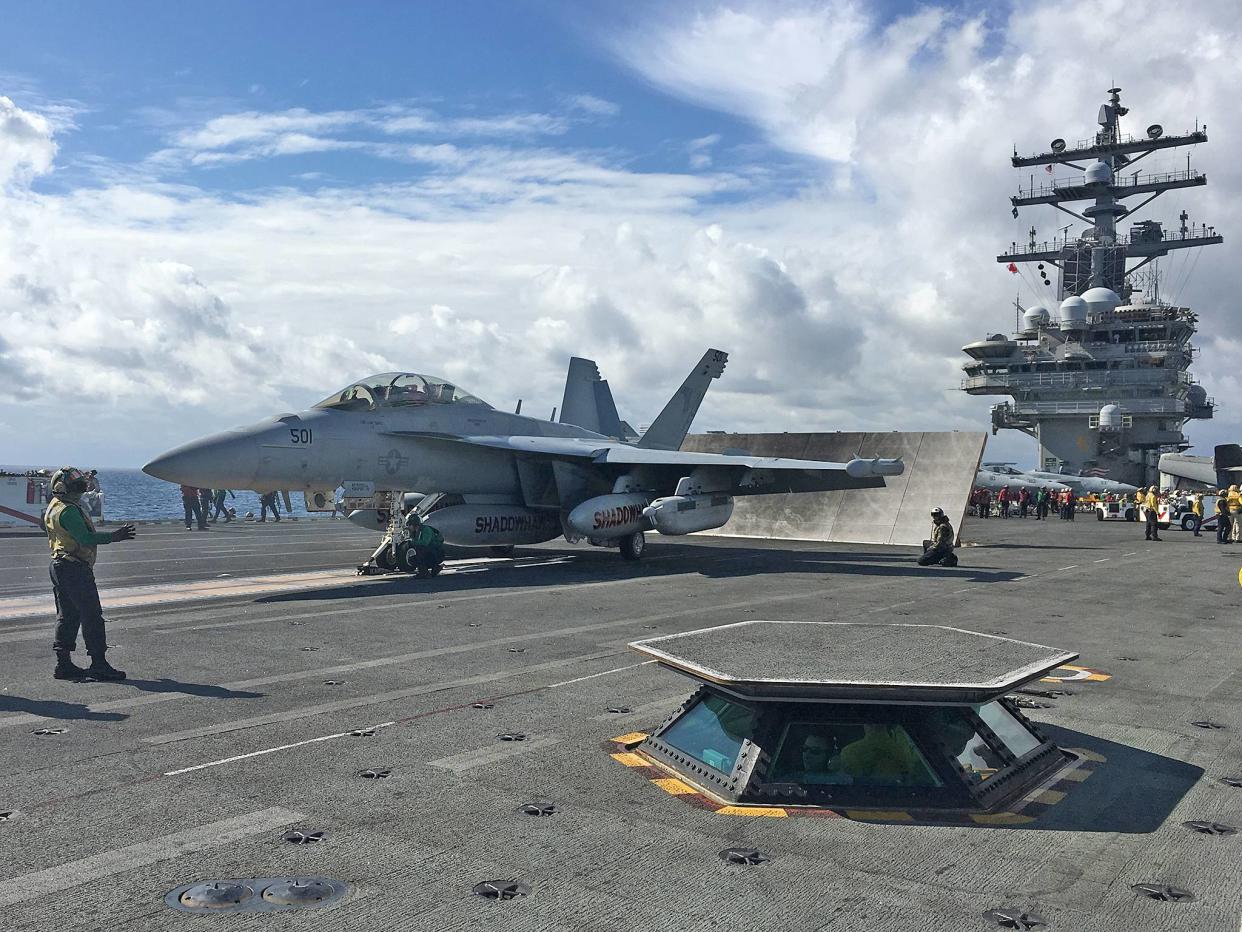 A US Nay jet on an aircraft carrier: REUTERS