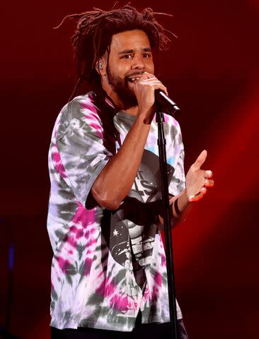 <p>Kevin Winter/Getty</p> J. Cole performs onstage during the 2021 iHeartRadio Music Festival on September 17, 2021 in Las Vegas, Nevada.