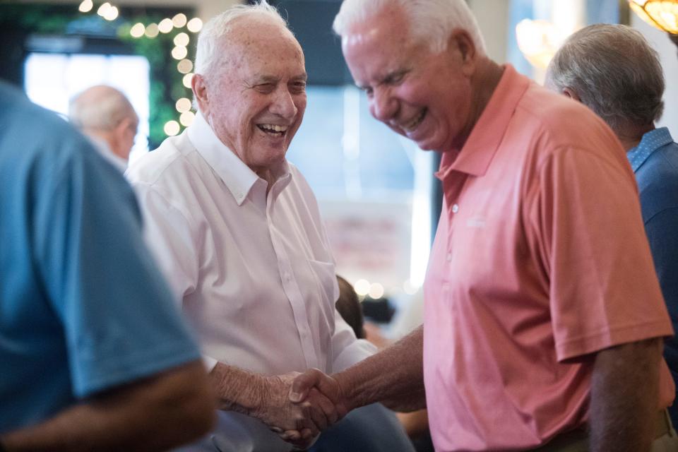 Bobby Smith, left, laughs as he makes his way around the room reuniting with longtime friends during a gathering of former Little Italy residents Thursday, June 16, 2022, at Mrs. Robino's Restaurant.