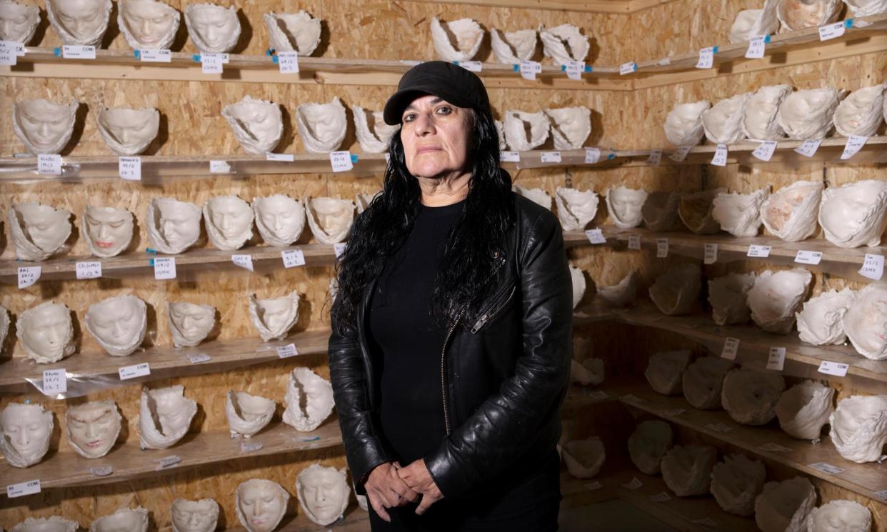 <span>‘I’m afraid of both life and death’ … the ex-forensic pathologist with some of the face casts.</span><span>Photograph: Graeme Robertson/The Guardian</span>