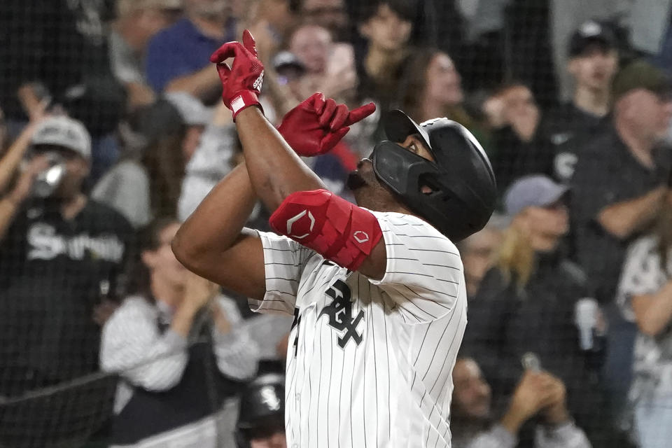 Chicago White Sox's Eloy Jimenez celebrates after his home run off Detroit Tigers starting pitcher Drew Hutchison during the fourth inning of a baseball game Saturday, Sept. 24, 2022, in Chicago. (AP Photo/Charles Rex Arbogast)