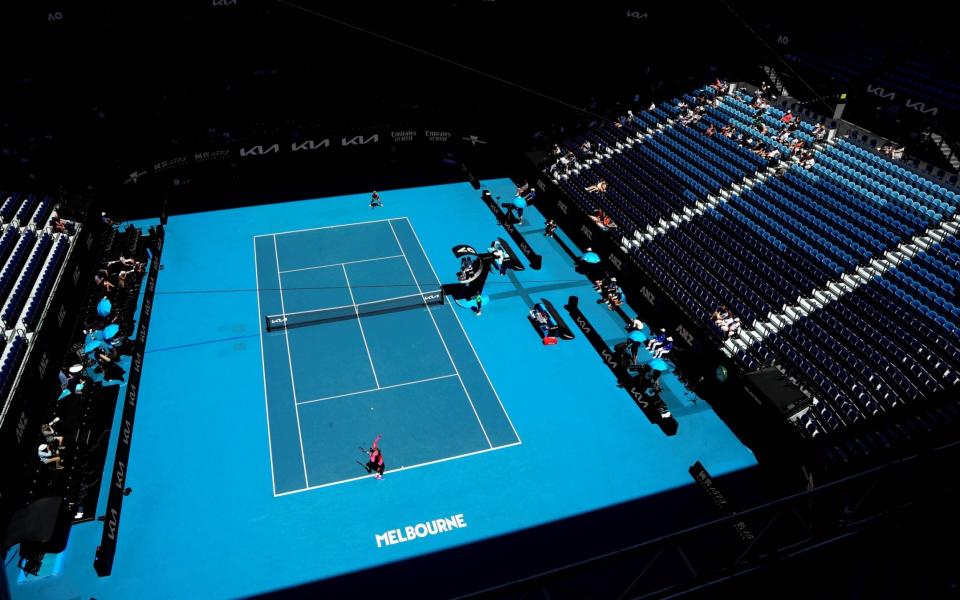 Serena Williams serves in a nearly-empty Rod Laver Arena on Friday - GETTY IMAGES