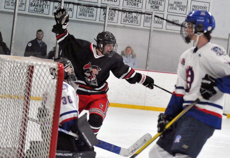 North Quincy's David D'Antona, center, celebrates a goal as Quincy goalie Tyler Holmes, left, reacts, during the Holiday Tournament at the Quincy Youth Arena, Tuesday, Dec. 27, 2022.