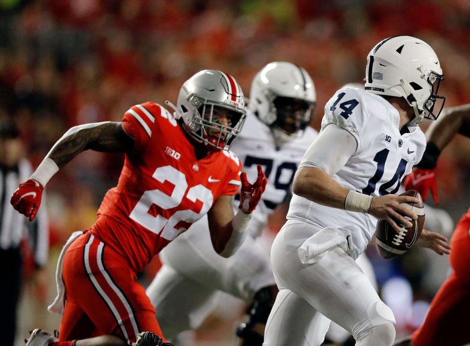 Ohio State Buckeyes linebacker Steele Chambers (22) chases after Penn State Nittany Lions quarterback Sean Clifford (14) during the first quarter of their game at Ohio Stadium in Columbus, Ohio on October 30, 2021. 