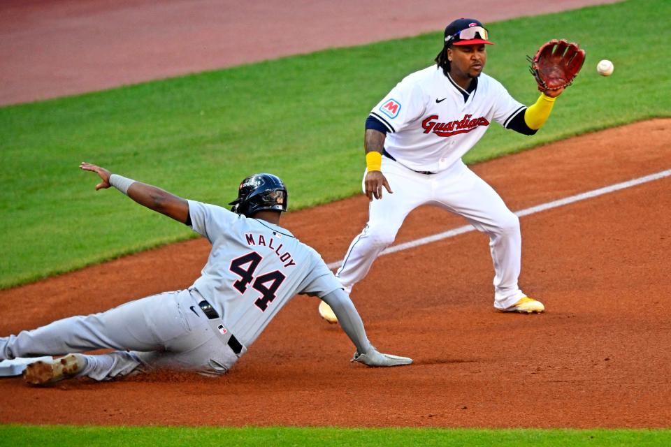 Tigers outfielder Justyn-Henry Malloy reaches third before the throw to Guardians third baseman José Ramírez in the third inning in Game 2 of the ALDS, Oct. 7, 2024, in Cleveland.