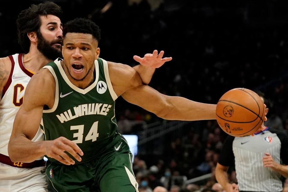 Milwaukee Bucks forward Giannis Antetokounmpo is fouled by Cavaliers guard Ricky Rubio during the second half of the Bucks' 112-104 win Monday night in Milwaukee. [Morry Gash/Associated Press]