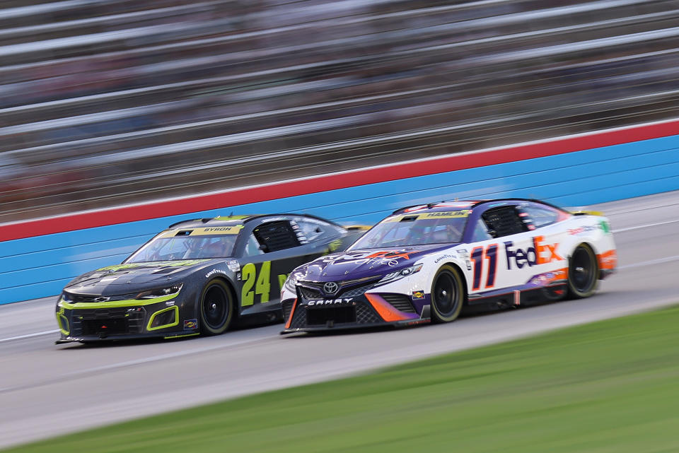 FORT WORTH, TEXAS - SEPTEMBER 25: Denny Hamlin, driver of the #11 FedEx Office Toyota, and William Byron, driver of the #24 RaptorTough.com Chevrolet, race during the NASCAR Cup Series Auto Trader EchoPark Automotive 500 at Texas Motor Speedway on September 25, 2022 in Fort Worth, Texas. (Photo by Jonathan Bachman/Getty Images)