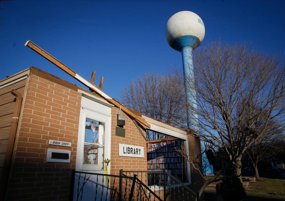 Cleanup at the public library in Rudd, Iowa, began on Thursday, Dec. 16, 2021, after a confirmed EF-1 tornado touched down on the town of 359 residents Wednesday night, leaving multiple homes damaged. The storm was part of a band of severe weather that raked across much of Iowa Wednesday night.