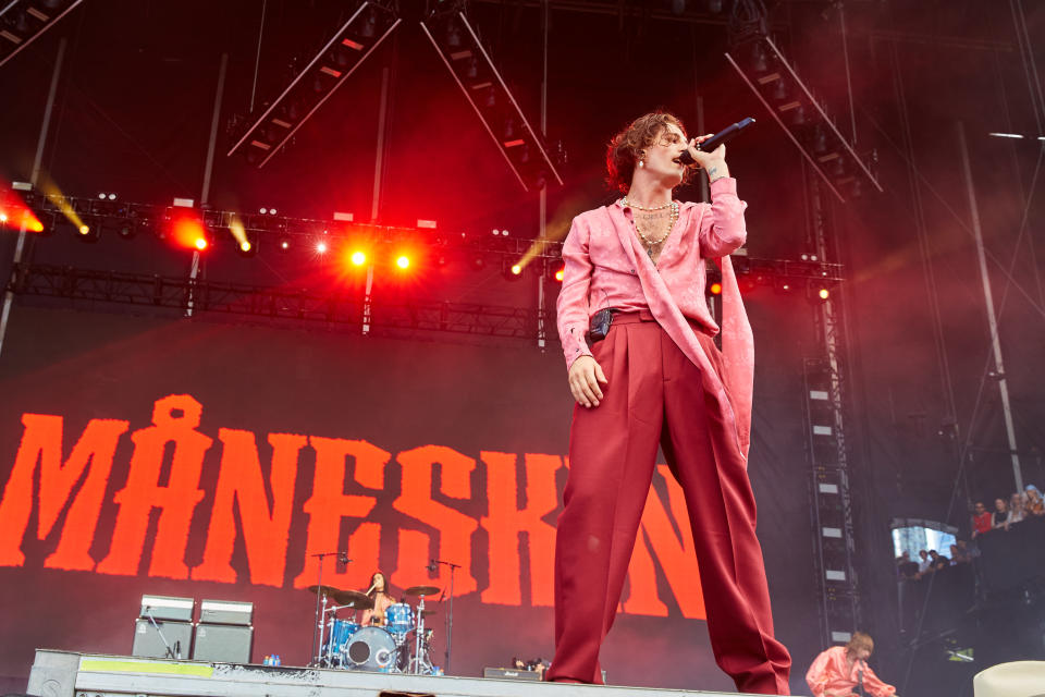 CHICAGO, ILLINOIS - JULY 31: Damiano David, Ethan Torchio, and Thomas Raggi of Måneskin perform during day 4 of Lollapalooza at Grant Park on July 31, 2022 in Chicago, Illinois. (Photo by Barry Brecheisen/WireImage)