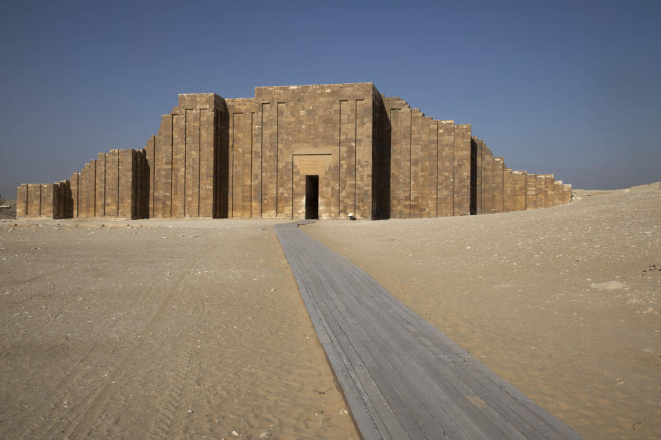 A path leads to the entrance of the southern cemetery of King Djoser, after its restoration, near the famed Step Pyramid, in Saqqara, south of Cairo, Egypt, Tuesday, Sept. 14, 2021. (AP Photo/Nariman El-Mofty)