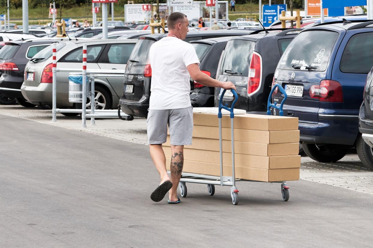 Man moving Ikea products to his car