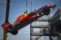 Formula One - Monaco Grand Prix - Monaco - 28/5/16. A crane lifts the car of Red Bull Racing's F1 driver Max Verstappen after his crash during the qualifying session. REUTERS/Andrej Isakovic/Pool