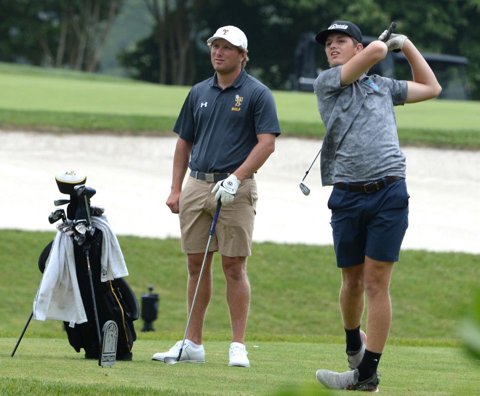 Josh Freeman of St. Georges (right) hits his tee shot on the 11th hole as Tatnall's Matthew Homer looks on at the DIAA Golf Tournament at Baywood Greens Golf Club in Long Neck last year.