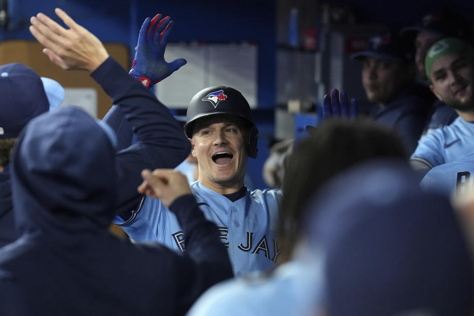 Toronto Blue Jays' Matt Chapman is congratulated for his solo home run against the New York Yankees during the fourth inning of a baseball game Thursday, Sept. 28, 2023, in Toronto. (Chris Young/The Canadian Press via AP)