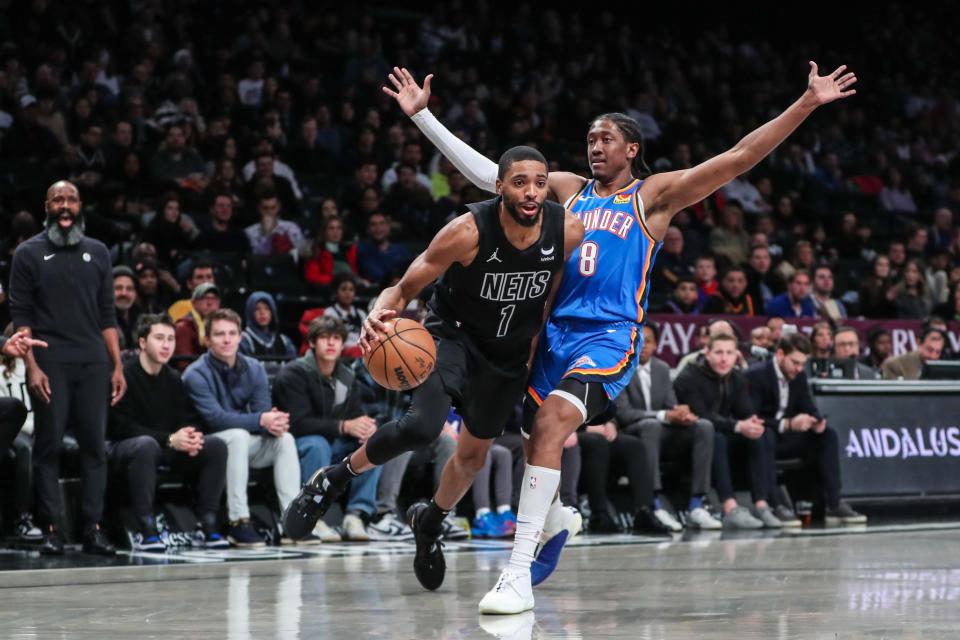 Jan 5, 2024; Brooklyn, New York, USA; Brooklyn Nets forward Mikal Bridges (1) drives past Oklahoma City Thunder forward Jalen Williams (8) in the first quarter at Barclays Center. Mandatory Credit: Wendell Cruz-USA TODAY Sports