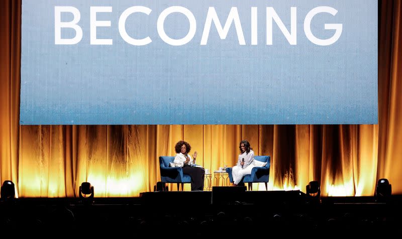 FILE PHOTO: Oprah Winfrey talks with former first lady Michelle Obama in Chicago