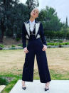 <p>goes big on bling in a bejeweled three-piece Dolce & Gabbana suit featuring a wide statement lapel, Candy Ice jewelry and Christian Louboutin heels. </p>