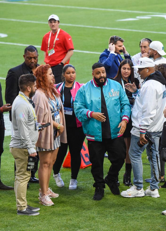 Rapper and record producer DJ Khaled, a well-known sneaker head, walks onto the field at Hard Rock Stadium before Super Bowl LIV in February 2020.