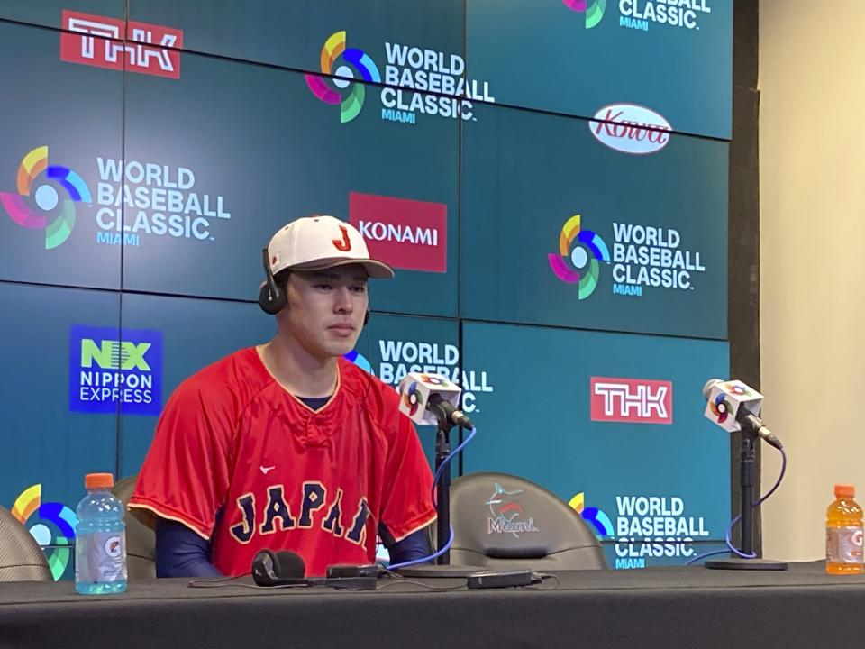 Pitcher Roku Sasaki of Japan speaks at a news conference at LoanDepot Park in Miami on Sunday, March 19 2023, ahead of a World Baseball Classic semifinal against Mexico. (AP Photo/Ron Blum )