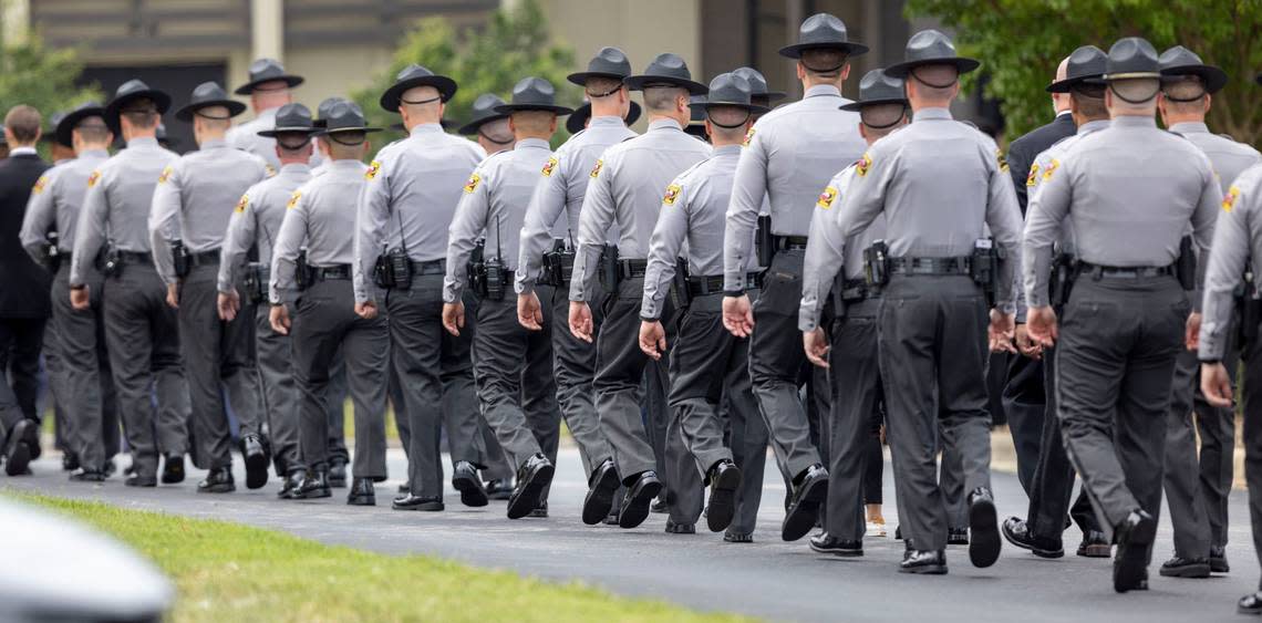 North Carolina State Highway Patrol officers march in formation to Providence Baptist Church for Wake County Deputy Ned Byrds funeral on Friday, August 19, 2022 in Raleigh, N.C.
