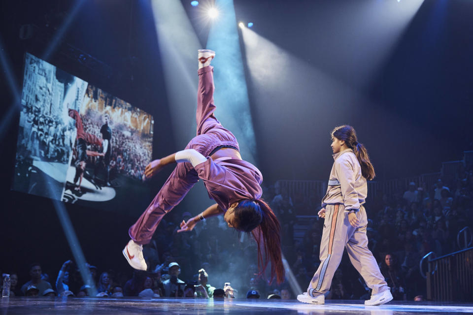 Logan Edra, also known as B-Girl Logistx, from United States competes against India from Netherlands in the B-girl Red Bull BC One World Final at Hammerstein Ballroom on Saturday, Nov. 12, 2022, in Manhattan, New York. The International Olympic Committee announced two years ago that breaking would become an official Olympic sport, a development that divided the breaking community between those excited for the larger platform and those concerned about the art form’s purity. (AP Photo/Andres Kudacki)