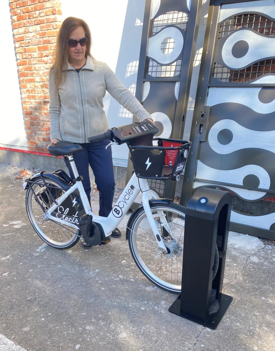 Anne Thomas stands next to an electric BCycle, which will be used in the Redding Bikeshare program, part of the Shasta Bike Depot, which is scheduled to open May 12, 2023.