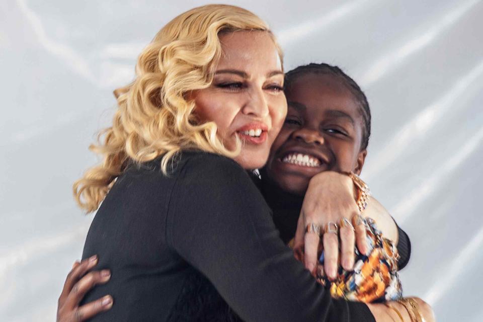 <p>AMOS GUMULIRA/AFP via Getty</p> Madonna and  Mercy James on July 11, 2017 in Blantyre, Malawi.