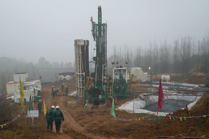 FILE PHOTO: Greka workers are seen at a coalbed methane drilling site in Jincheng