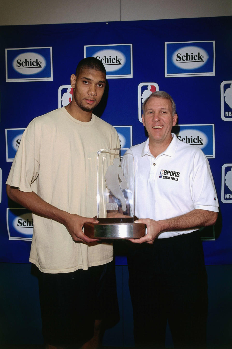<p>1998: Tim Duncan #21 of the San Antonio Spurs poses for a portrait with Gregg Popovich during the Rookie of the Year press conference on April 27, 1998 in San Antonio, Texas.<br></p>