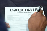 An applicant fills out a job employment form during the Lee County Area Job Fair in Tupelo, Miss., Tuesday, Oct. 12, 2021. Employers representing a variety of manufacturing, production, service industry, medical and clerical companies attended the day long affair with an eye towards recruitment, hiring, training and retention. (AP Photo/Rogelio V. Solis)