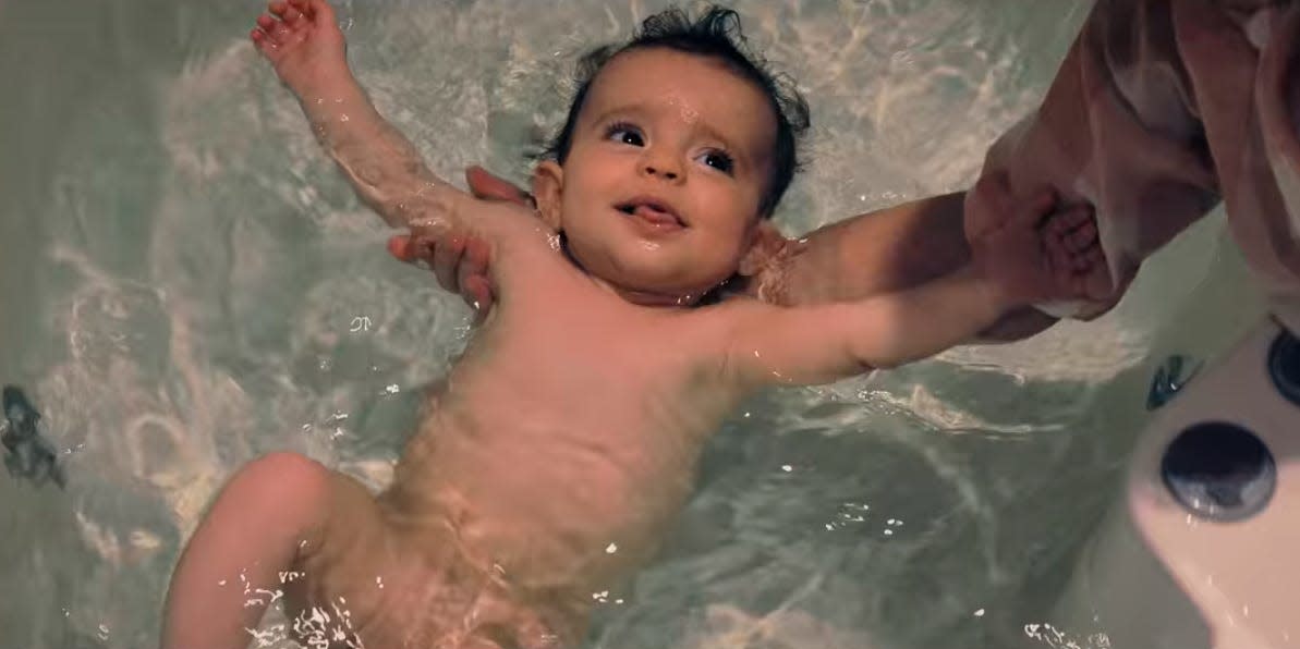 Baby in bath water