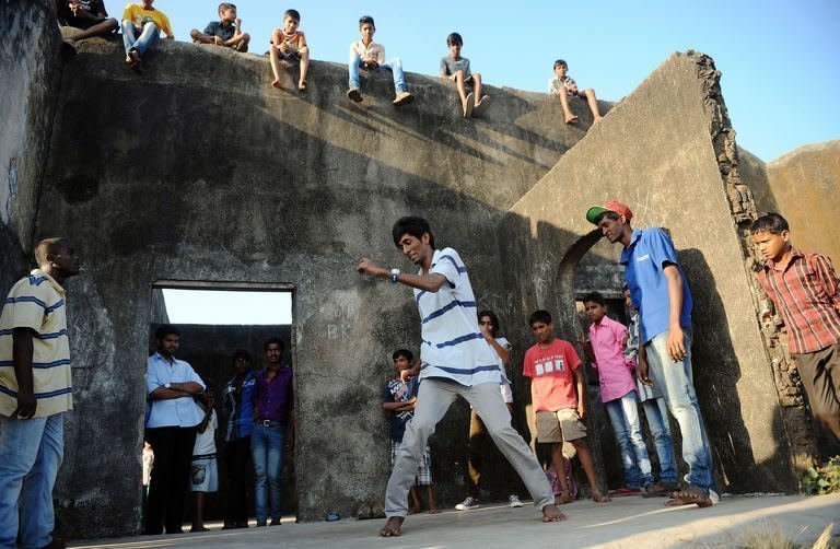 SlumGods members take part in a dance practice at the Sion fort in Mumbai on November 30, 2012. They want to show there is more to life in a Mumbai shantytown than poverty and squalor -- even if the hit film "Slumdog Millionaire" suggested otherwise