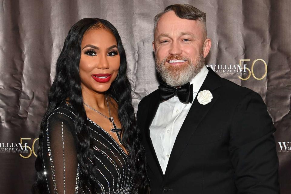 <p>Paras Griffin/Getty</p> Tamar Braxton and Jeremy "JR" Robinson attend Bishop William Murphy