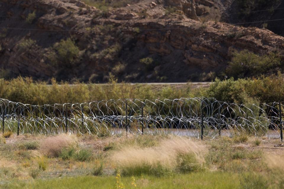 Texas National Guard troops placed concertina wire along the Rio Grande by Mt. Cristo Rey in New Mexico and Texas.